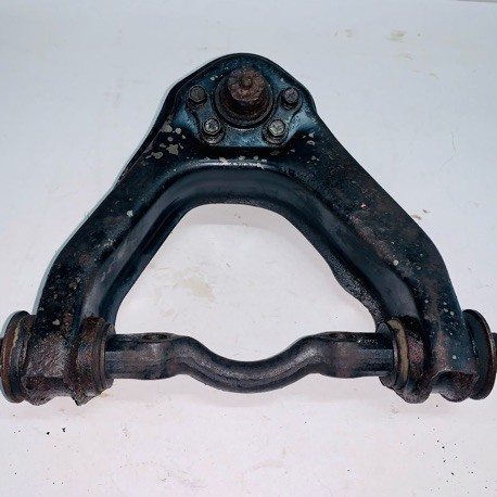 CONTROL ARM UPPER LH NISSAN E24